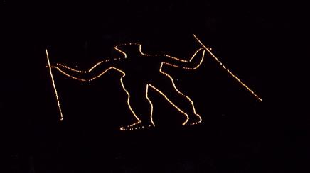 The Long Man illuminated at night